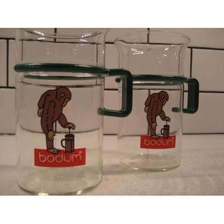 BOGO 40% OFF // Pair of Vintage Bodum Glass Mugs - Monkey making French press coffee - Removeable Green plastic handles - Curious George thumb